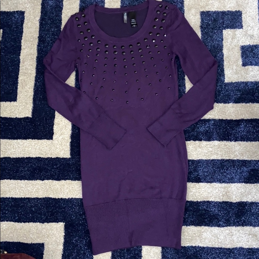 Purple sweater dress with black rhinestones.